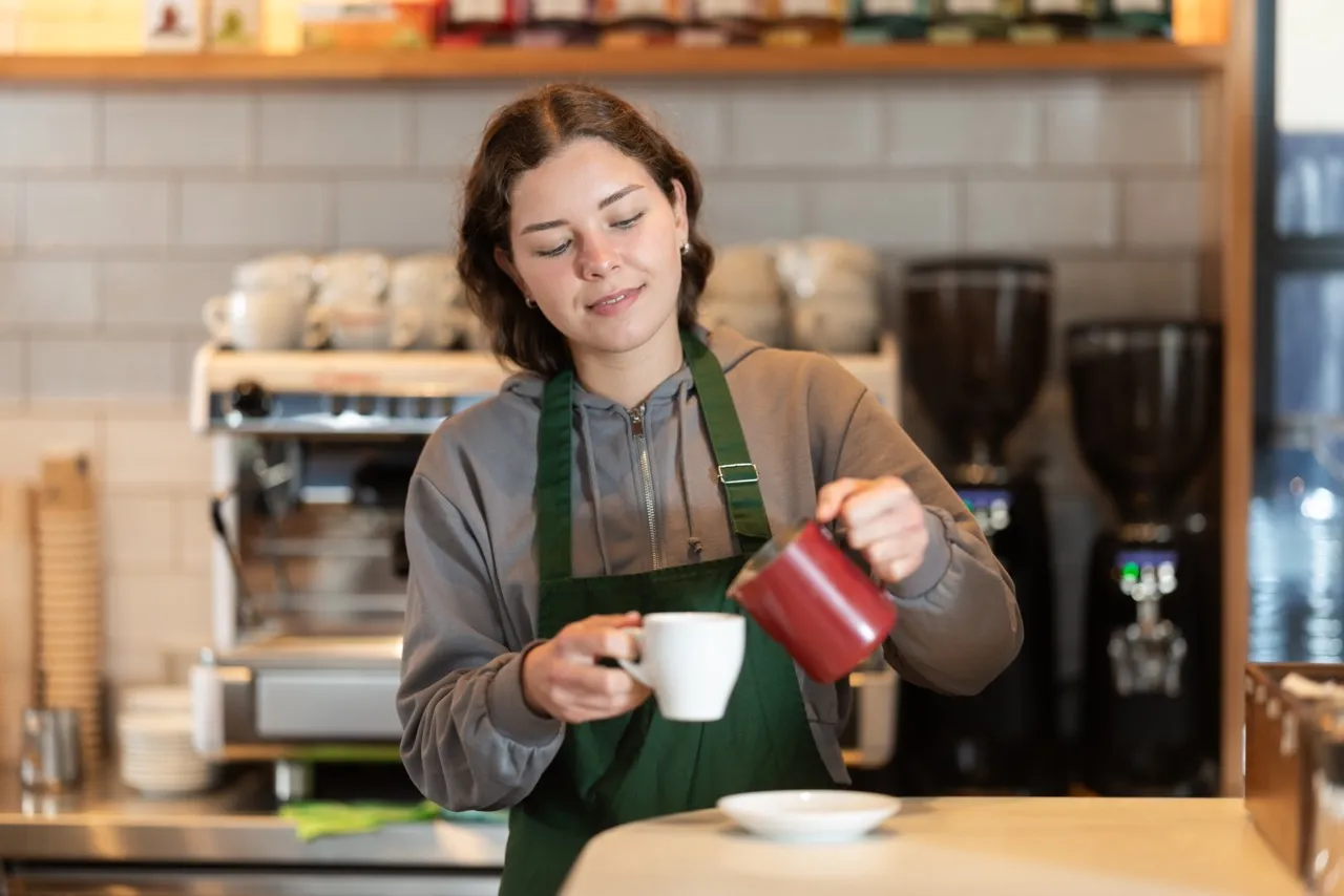 barista making coffee